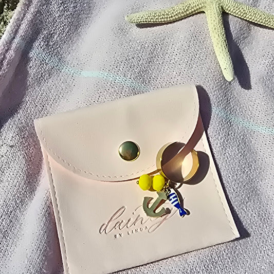 thick gold ring with dangly fish anchor and beads waterproof