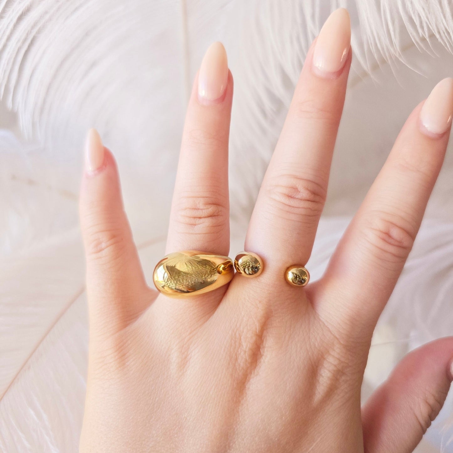 gold statement ring on