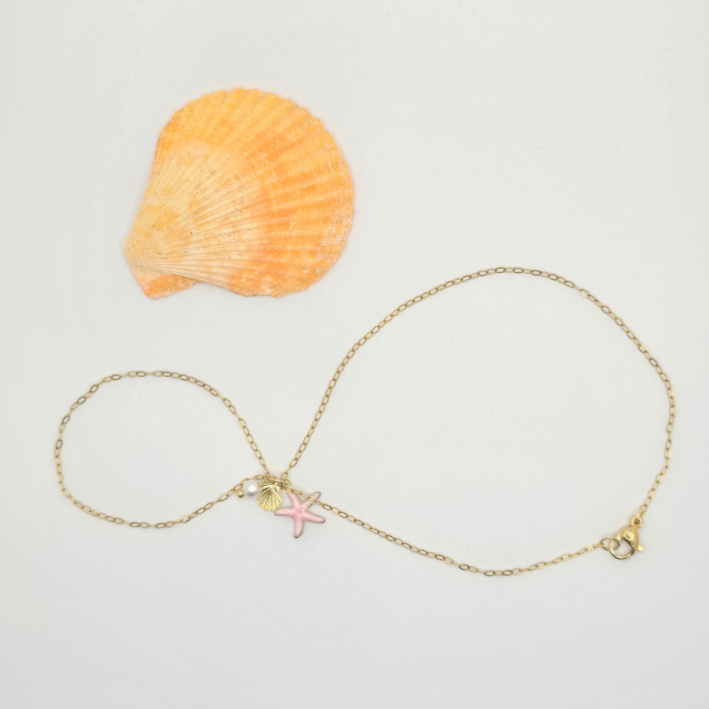 dainty pink star gold hand chain