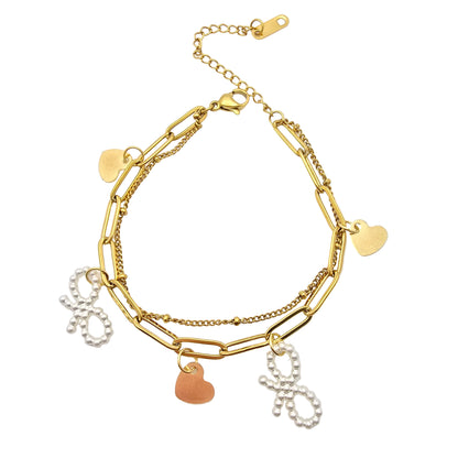 cute dainty gold bracelet with hearts and bows