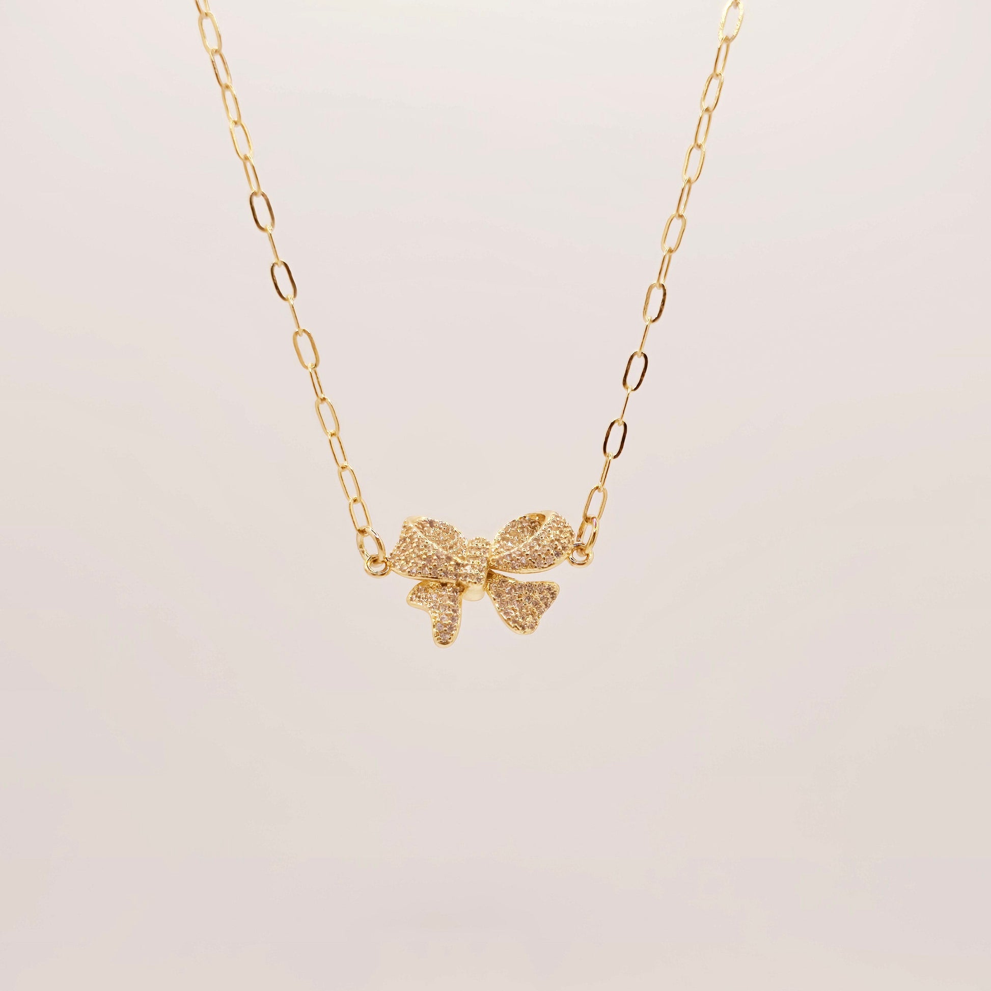 dainty gold bow necklace girly layering
