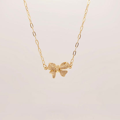 dainty gold bow necklace girly layering