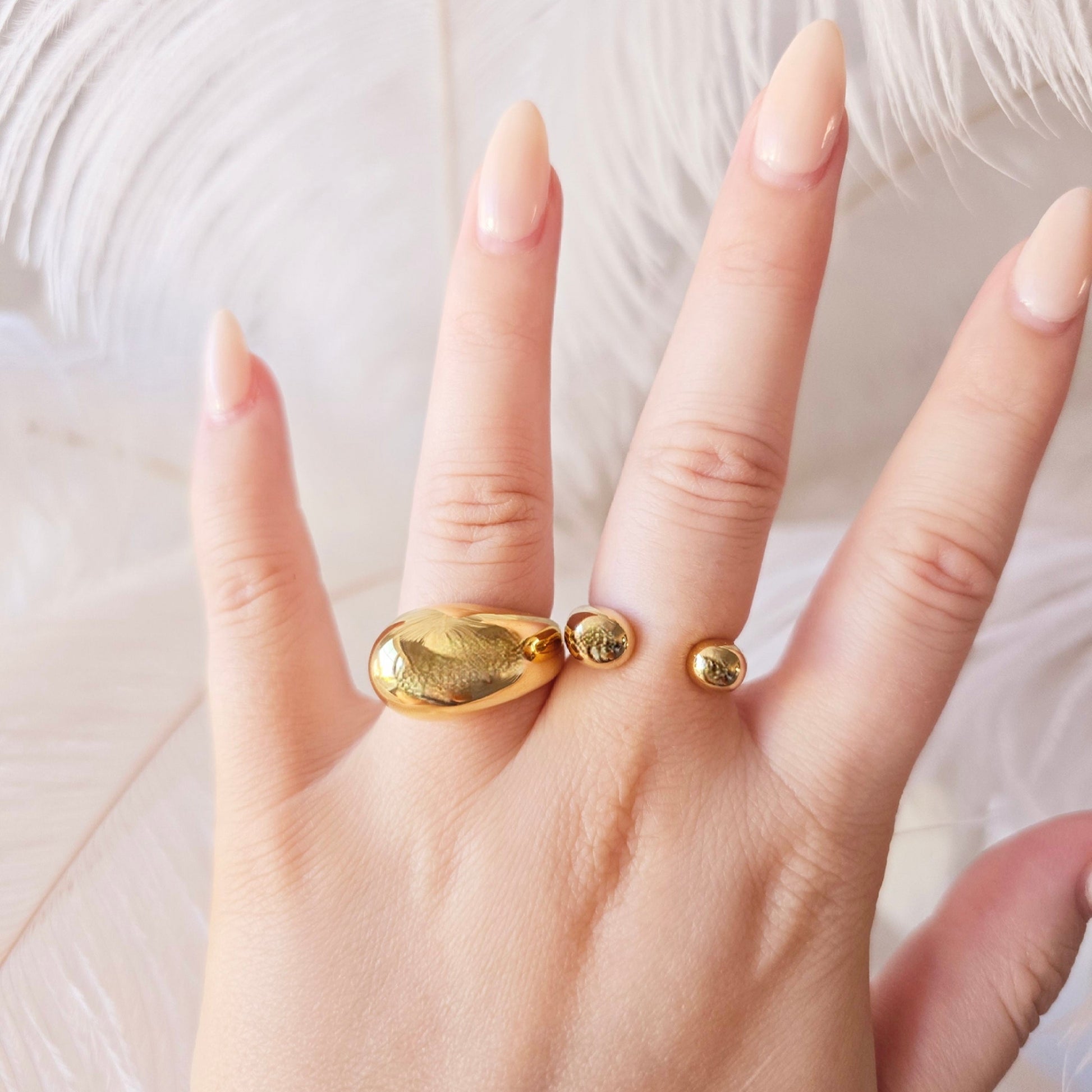 gold statement ring on