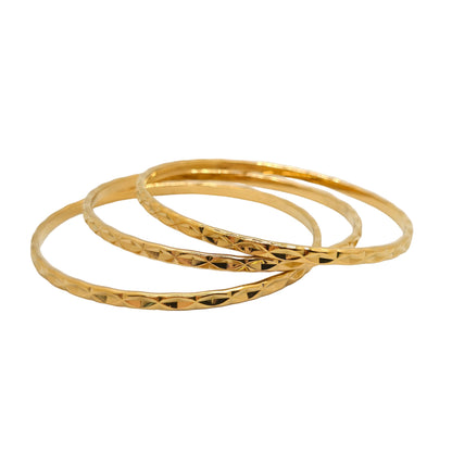 trio of gold bangles stack