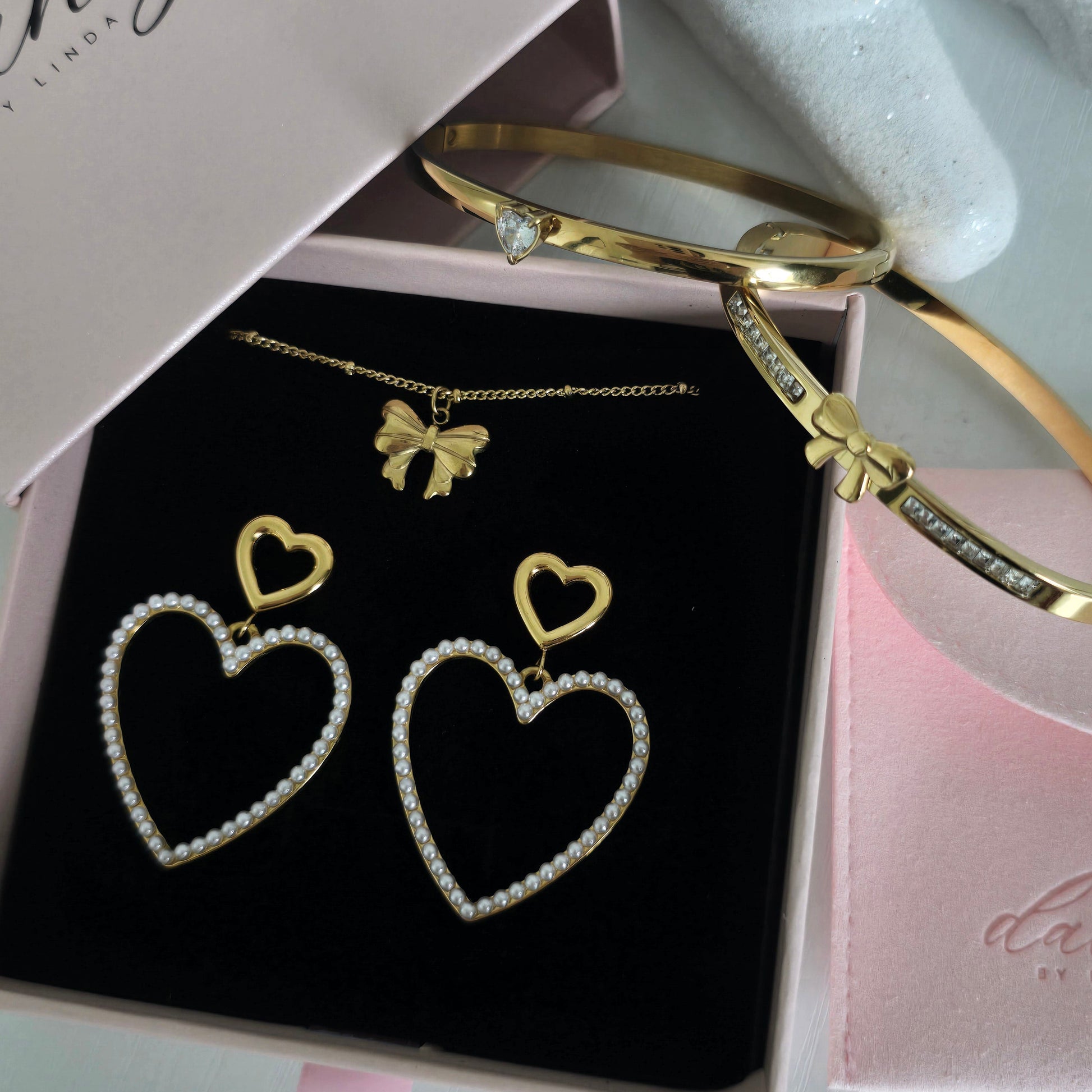 statement heart earrings bow heart bangles