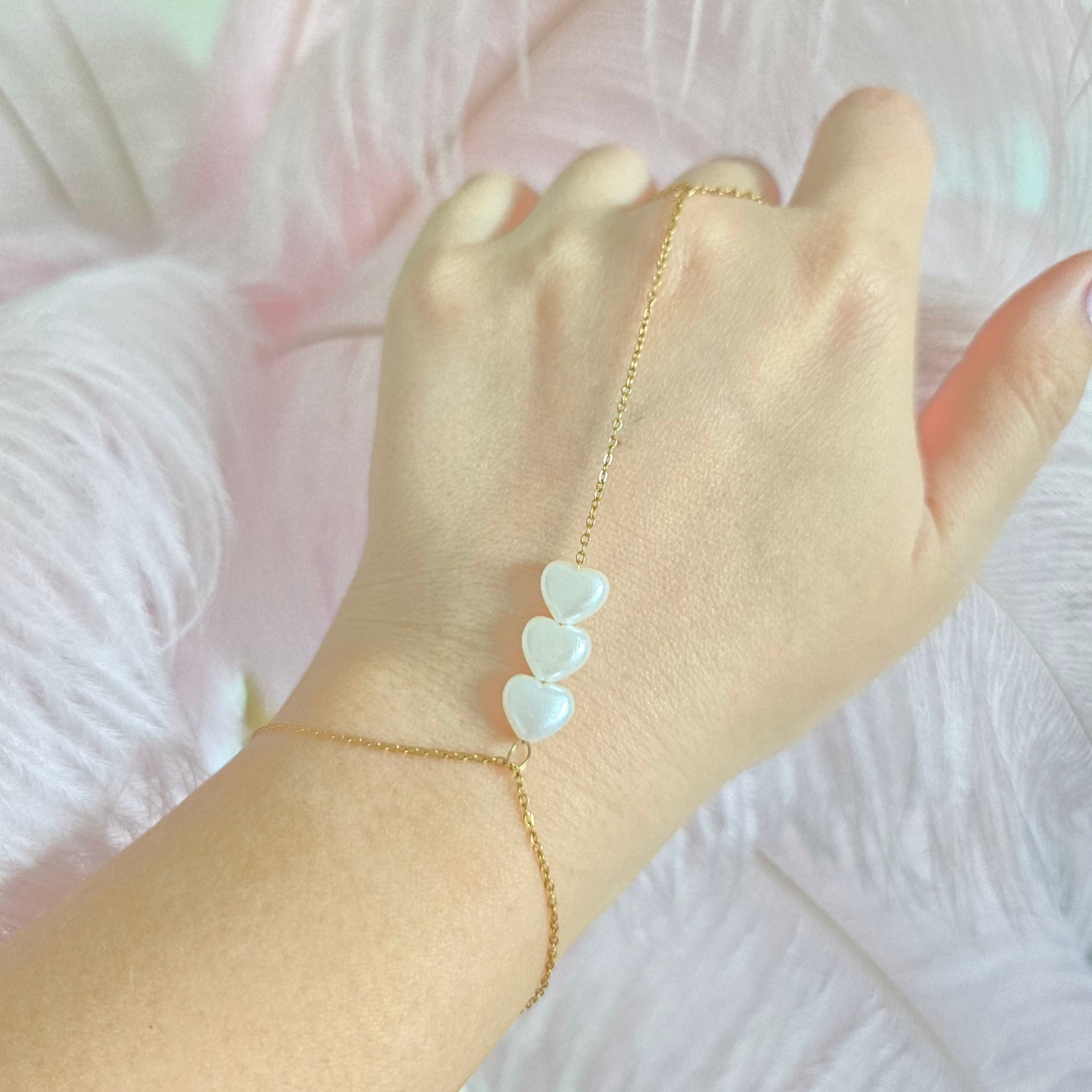 moveable pearl hearts hand chain unique