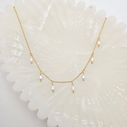 dainty gold pearls necklace layering
