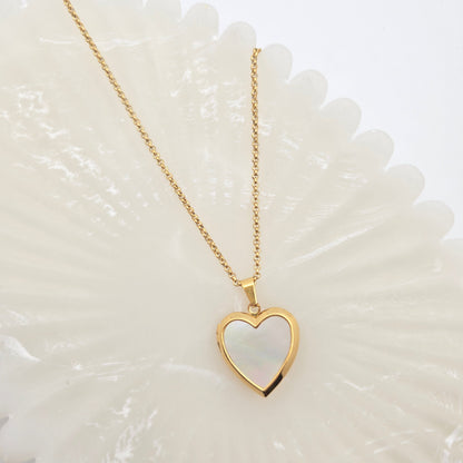 dainty gold mother of pearl heart locket