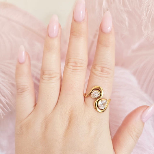 dainty gold ring with pear diamonds statement