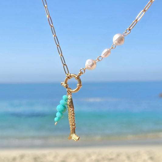 fish with emerald beads and pearl necklace gold