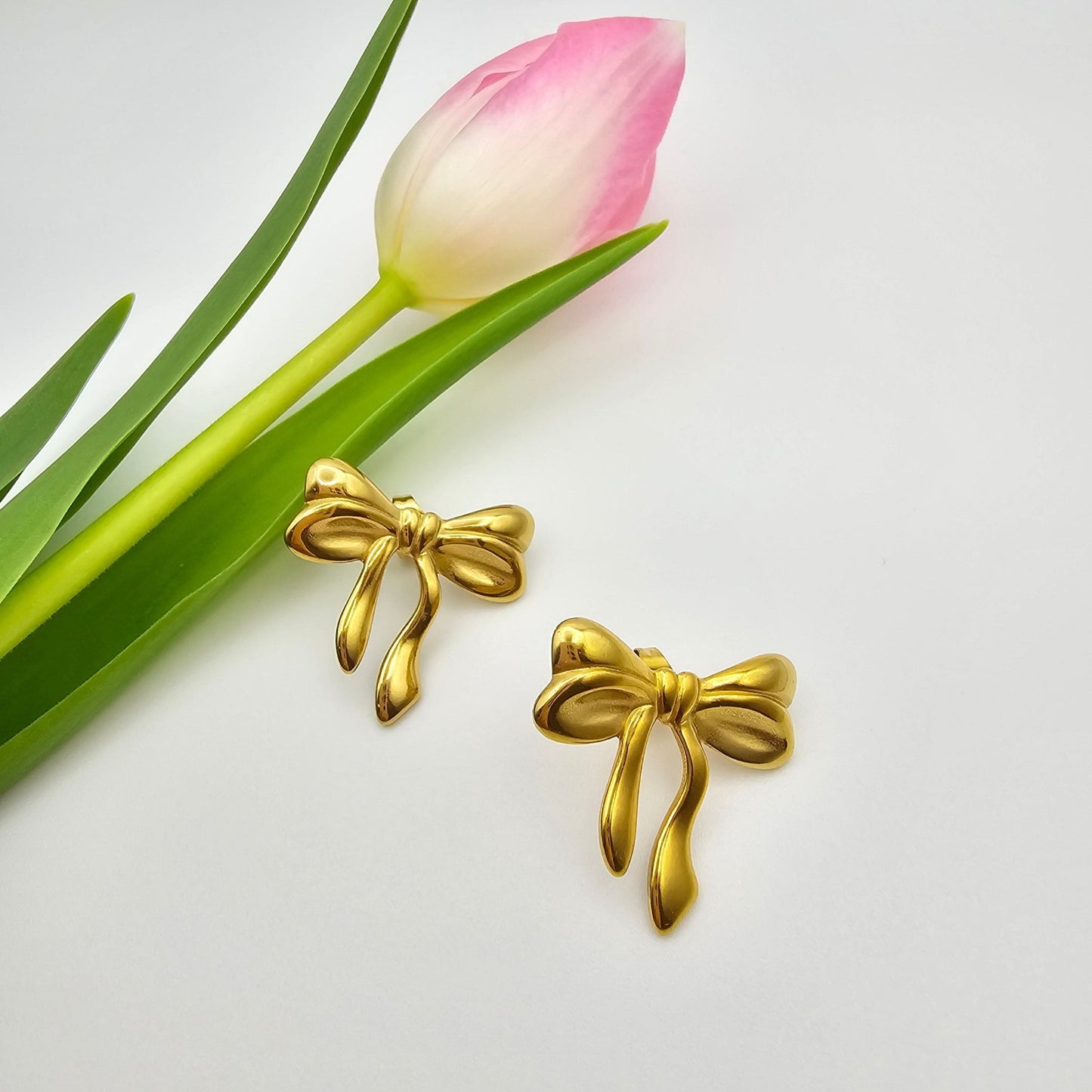 gold bow stud earrings delicate